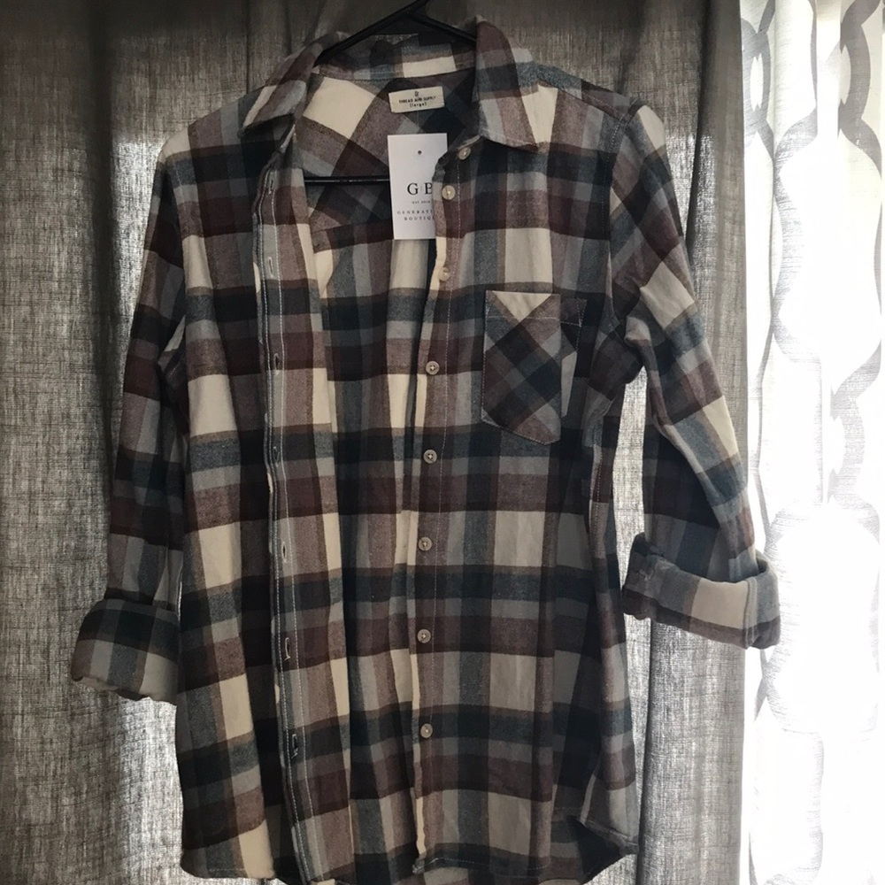Blue, maroon, ivory, and rust plaid shirt